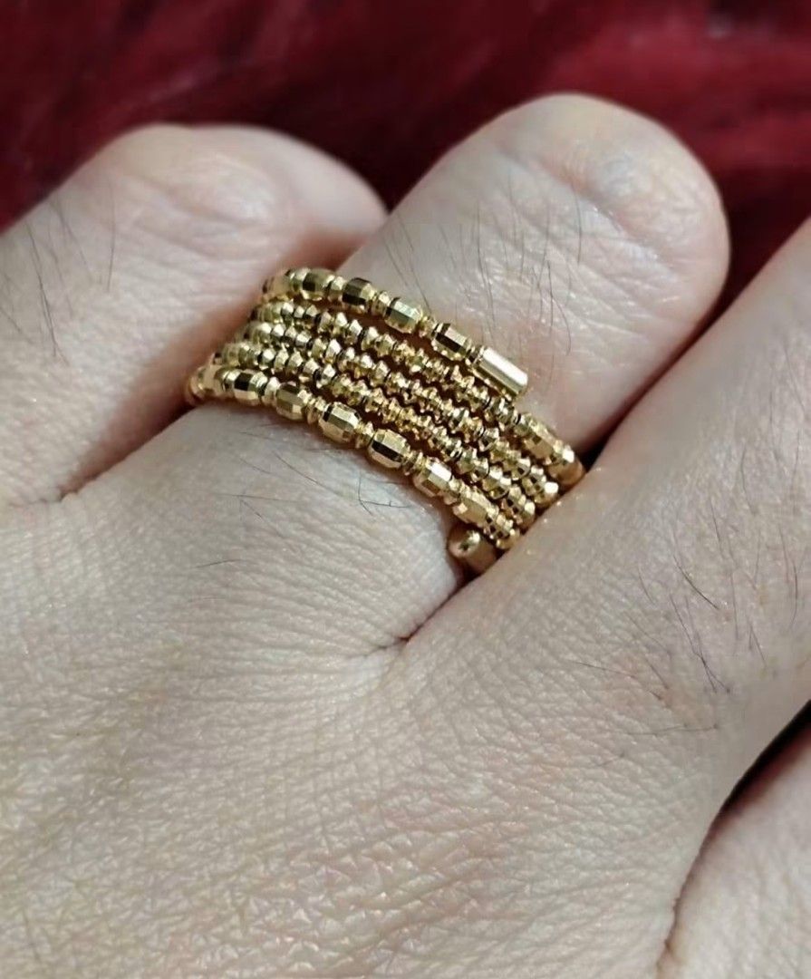 Gold multi-strand beaded spiral ring (Category: Rings) located in Navotas City. Submitted by leriecaspe00 (Listing ID 1465789324, Image 2). Description: - Stunning gold ring with a multi-strand spiral design - Features small textured beads wrapped all the way around - Adjustable wrap style fits various finger sizes comfortably - Lightweight and catches the light nicely - Versatile everyday piece that elevates any outfit.
