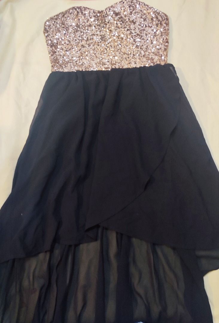 Gold Sequin Black High Low Strapless Dress (Category: Evening dresses & gowns) located in Marikina City. Submitted by julysapparel_40 (Listing ID 1465826839, Image 2). Description: - Style: Gold sequin strapless top with a flowing black chiffon high-low skirt - Design: Sweetheart neckline, layered sheer fabric underneath - Condition: Worn only once, clean, and ready to wear - Ideal For: Parties, clubbing, or special night outs.
