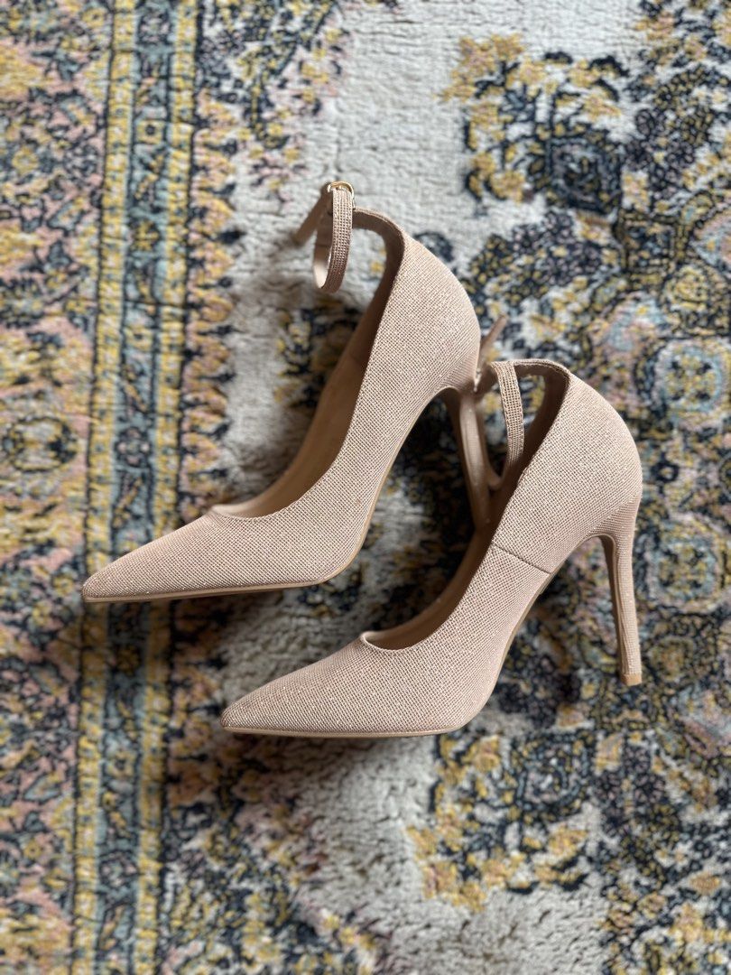 Gold Sparkly Ankle Strap Stilettos (Category: Heels) located in Davao. Submitted by declutteringz_04 (Listing ID 1465832001, Image 2). Description: - Style: Pointed-toe stiletto heels with a slim ankle strap and buckle closure - Color/Finish: Nude with fine glitter (stunning sparkle under lights) - Comfort: Features a cushioned inner sole - Condition: Worn once for a few hours, barely any wear on the bottom soles - Perfect for: Parties, weddings,