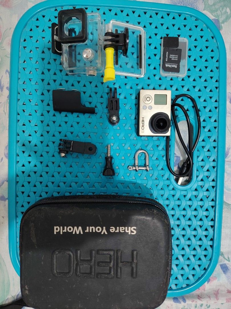 GoPro Hero 3 Action Camera Bundle with Case and Accessories (Category: Video Cameras) located in Paranaque City. Submitted by lucille1280 (Listing ID 1465794539, Image 2). Description: - GoPro Hero 3 action camera, tested and working - Waterproof housing case included - SanDisk microSD memory card with adapter - USB charging cable - Extra mounts and thumbscrews - Hard zippered carrying case with custom foam cutout - Ideal for outdoor sports, trav