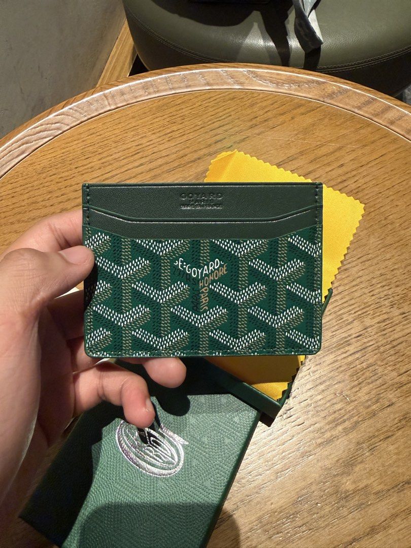 Goyard Green Saint Sulpice Card Holder (Category: Luxury Bags & Wallets) located in Manila. Submitted by adriyawnnn (Listing ID 1465946134, Image 1). Description: - Model: Goyard Saint Sulpice Card Holder - Color: Green with iconic chevron print - Storage: Multiple card slots on both sides and a central pocket - Branding: Stamped Goyard Paris inside and out - Inclusions: Matching green box and yellow dust cloth - Condition: Unused, kept safely in