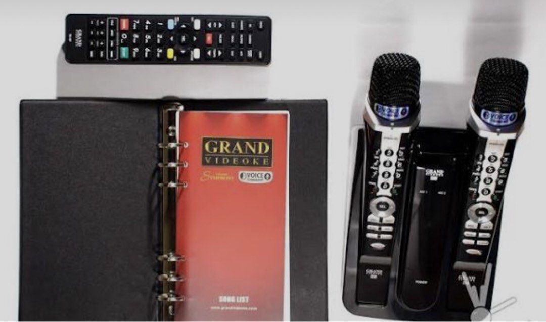 Grand videoke symphony SE Pro plus (Category: Microphones) located in Cavite. Submitted by ai__chang (Listing ID 1465934375, Image 2). Description: - Brand: Grand Videoke - Model: Symphony SE Pro Plus - Color: Black and Silver - Inclusions: 2 wireless microphones, base station, remote control, and official song list book - Features built-in keypad controls on microphones for easy song searching - Ideal for home use, parties, and family gatherings