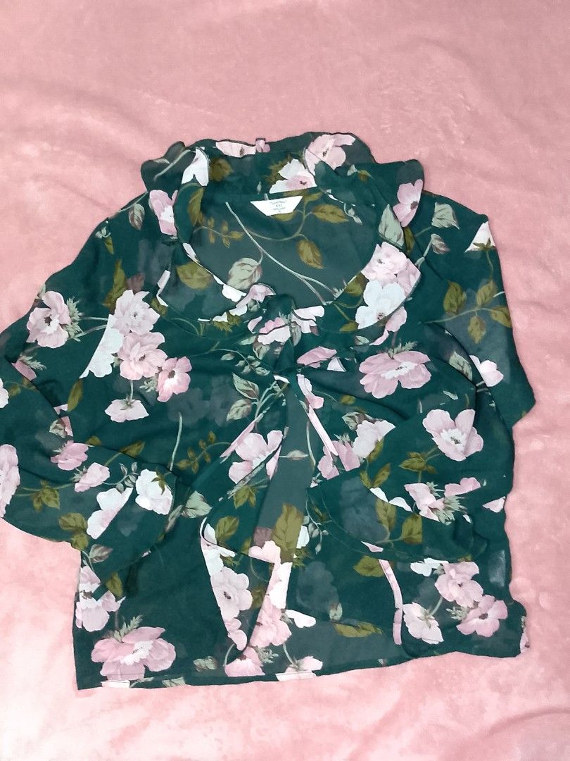 Grassy Meadow Tie-Neck Ruffle Blouse (Category: Longsleeves) located in Himamaylan. Submitted by _lalaoise (Listing ID 1465852893, Image 1). Description: Negotiable! I think the fabric is chiffon (lightweight and a little rasp) This is reallyyy pretty, flowy and ruffles on neck and hands, neck-tie. Shipping thru J &T..