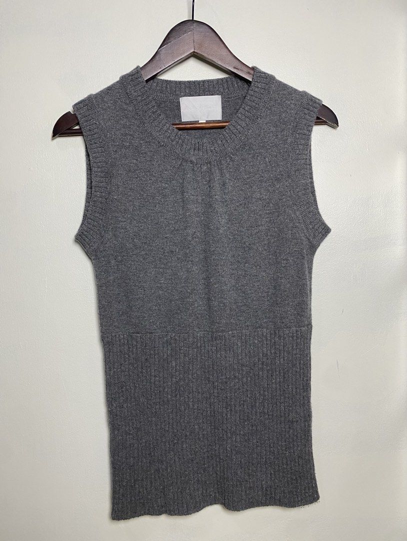 Gray knit vest (Category: Others Tops) located in Makati City. Submitted by indaysukaycloset (Listing ID 1465849993, Image 1). Description: GRAY KNIT VEST Brand: Japan Brand (Mind Wind Co. - tag faded) Size: Fits S-M Color: Gray / Charcoal Gray Details: - W-15 L-25 (laid flat, in inches) - Crew neck sleeveless knit vest - Gathered detail at front neckline - Thick ribbed hem at bottom (bodycon / long fit) - Soft, thick, makapal high-quality knit -