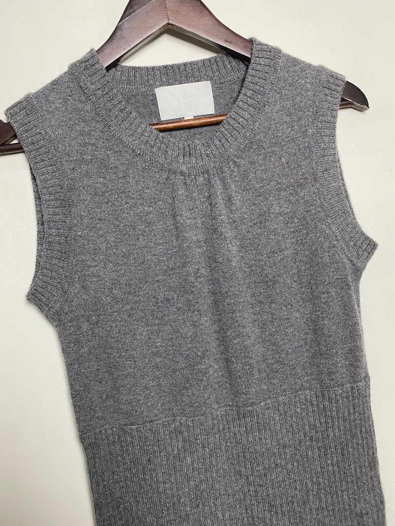 Gray knit vest (Category: Others Tops) located in Makati City. Submitted by indaysukaycloset (Listing ID 1465849993, Image 2). Description: GRAY KNIT VEST Brand: Japan Brand (Mind Wind Co. - tag faded) Size: Fits S-M Color: Gray / Charcoal Gray Details: - W-15 L-25 (laid flat, in inches) - Crew neck sleeveless knit vest - Gathered detail at front neckline - Thick ribbed hem at bottom (bodycon / long fit) - Soft, thick, makapal high-quality knit -