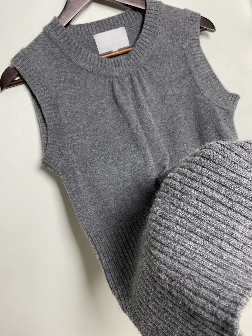 Gray knit vest (Category: Others Tops) located in Makati City. Submitted by indaysukaycloset (Listing ID 1465849993, Image 3). Description: GRAY KNIT VEST Brand: Japan Brand (Mind Wind Co. - tag faded) Size: Fits S-M Color: Gray / Charcoal Gray Details: - W-15 L-25 (laid flat, in inches) - Crew neck sleeveless knit vest - Gathered detail at front neckline - Thick ribbed hem at bottom (bodycon / long fit) - Soft, thick, makapal high-quality knit -