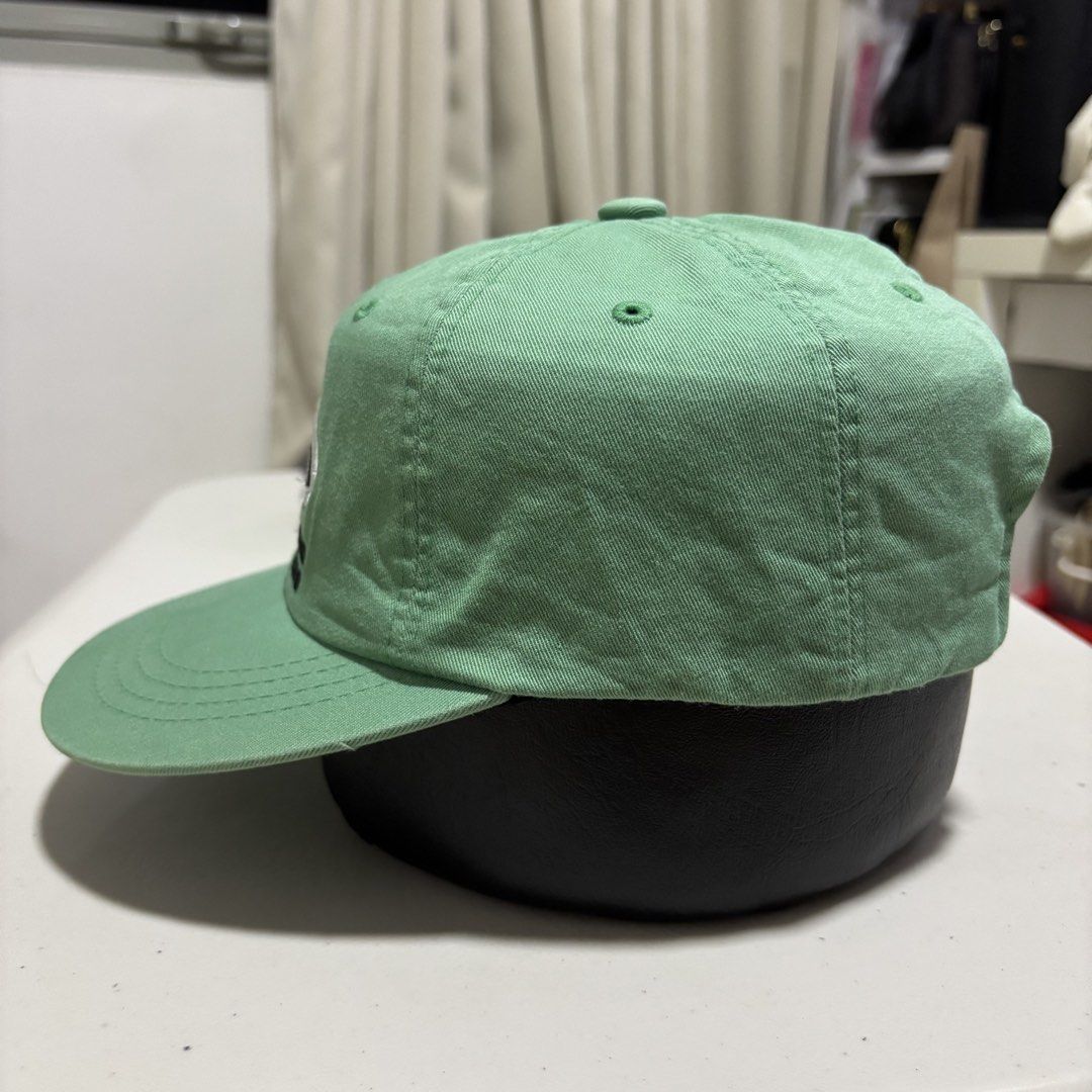 Green Camp Hat (Category: Caps & Hats) located in Quezon City. Submitted by grailph (Listing ID 1465882417, Image 2). Description: - Brand/Collab: The Moment x Unisex Market - Design: Green 6-panel cap with "Record" embroidered front patch - Size: M (with adjustable strap and silver metal clasp) - Details: Embroidered eyelets for breathability - Condition: Excellent/Ready to wear Color rate 7/10 Even fade.