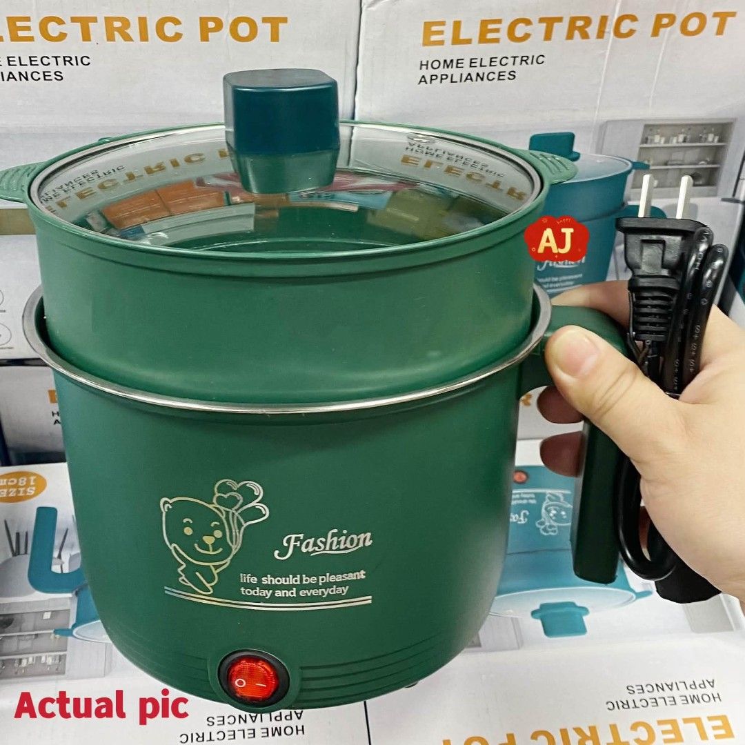 Green Multi-functional Electric Cooker Pot with Steamer Rack (Category: Cookers) located in Manila. Submitted by iliasjen3082126 (Listing ID 1465883757, Image 3). Description: - Color: Aesthetic green - Includes: Stainless steel inner pot, matching steamer tray, glass lid, and power cord - Fast heating: Perfect for quick noodles, hot pot, or steaming veggies - Space-saving: Compact size, ideal for dorm rooms and small apartments - Easy to store a