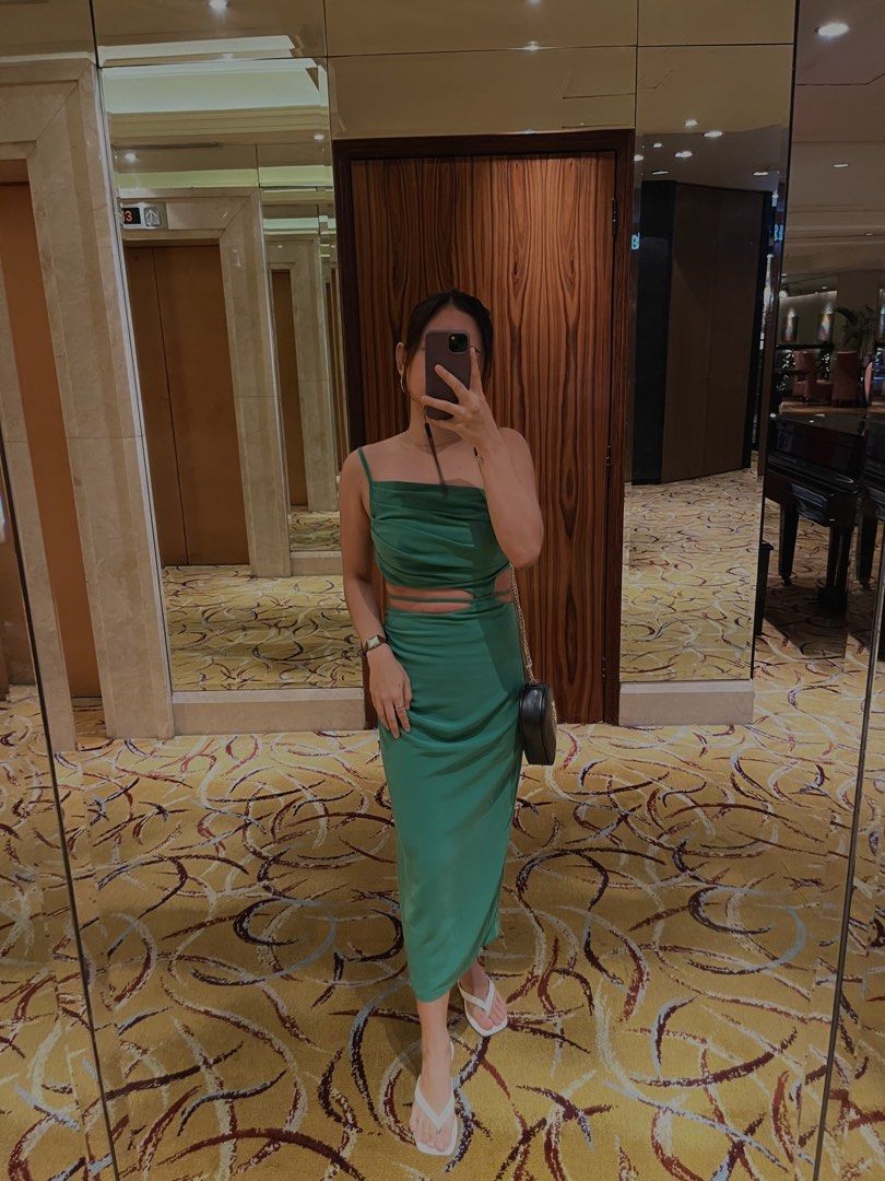 Green Ruched Midi Dress (Category: Dresses) located in Makati City. Submitted by secondhandstories07 (Listing ID 1465819040, Image 2). Description: Color: Green Length: Midi Fit: Regular fit Material: 92% Polyester, 8% Elastan Style: Cami / Sleeveless Details: Ruched, draped, knot, criss-cross & side slit Non-sheer Care: Machine wash or professional dry clean Perfect for dates, dinners, parties, or a night out. 💚.