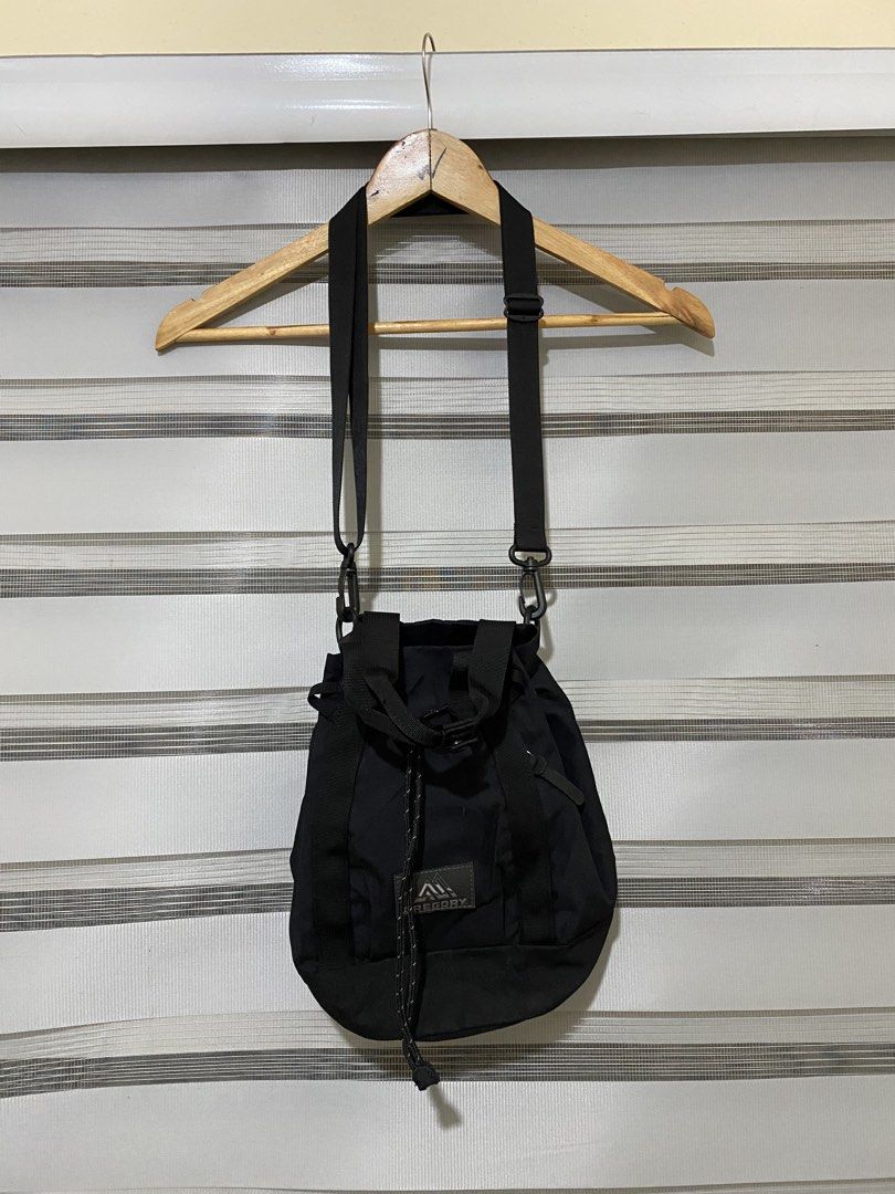 Gregory Black Bucket Crossbody Bag (Category: Cross-body Bags) located in Calapan. Submitted by metriowendell22 (Listing ID 1465784003, Image 3). Description: - Brand: Gregory - Style: Bucket bag / Outdoor minimalist - Material: Durable black nylon - Closure: Secure drawstring top - Carry options: Dual grab handles and removable shoulder strap - Capacity: Compact size, fits daily essentials - Condition: Clean inside and out, great everyday piece.