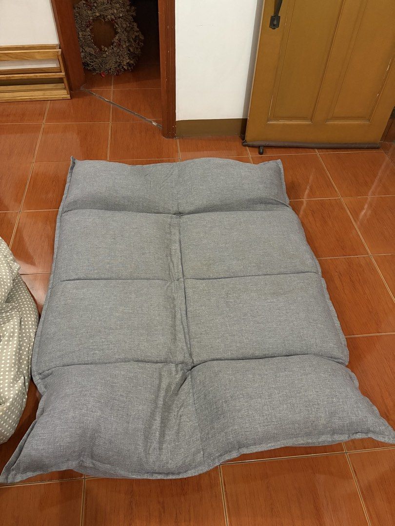 Grey folding floor sofa and lazy lounger bed (Category: Sofas) located in San Pedro. Submitted by icesyp (Listing ID 1465847656, Image 2). Description: - Versatile grey floor sofa for lounging, gaming, or napping - Adjustable sections: sits fully upright or lays flat like a mattress - Soft and comfortable fabric upholstery in a neutral grey tone - Easy to fold and store away when not in use - negotiable.