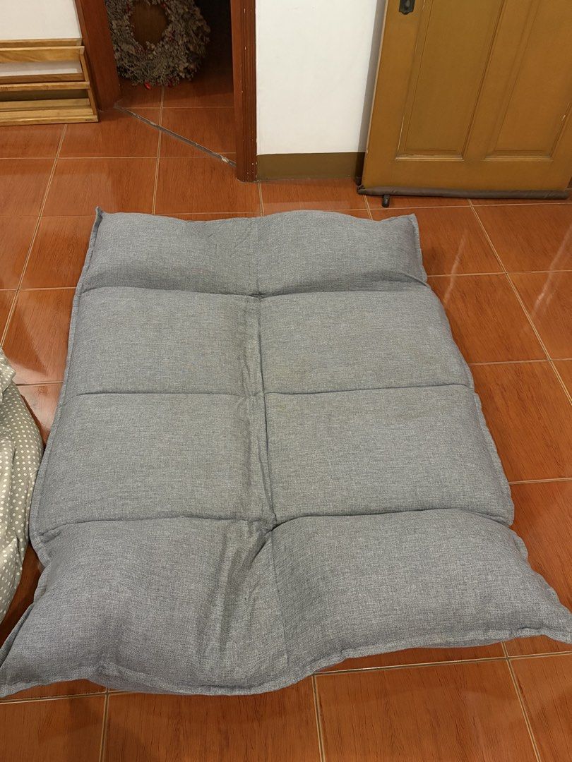 Grey folding floor sofa and lazy lounger bed (Category: Sofas) located in San Pedro. Submitted by icesyp (Listing ID 1465847656, Image 3). Description: - Versatile grey floor sofa for lounging, gaming, or napping - Adjustable sections: sits fully upright or lays flat like a mattress - Soft and comfortable fabric upholstery in a neutral grey tone - Easy to fold and store away when not in use - negotiable.
