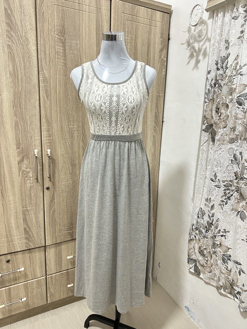 Grey Long Dress Sleeveless Lace Top (Category: Dresses) located in Cavite. Submitted by cl09-39734 (Listing ID 1465820421, Image 2). Description: - Style: Grey long maxi dress with a stunning white lace bodice - Neckline & Sleeves: Scoop neck, sleeveless design - Fit: Fitted waist with a comfortable, flowing skirt - Versatility: Great for everyday wear and casual outings - Comfort: Easy to slip on, made with soft and comfortable material.