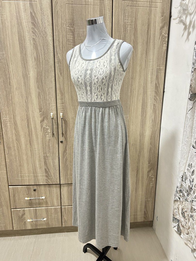 Grey Long Dress Sleeveless Lace Top (Category: Dresses) located in Cavite. Submitted by cl09-39734 (Listing ID 1465820421, Image 1). Description: - Style: Grey long maxi dress with a stunning white lace bodice - Neckline & Sleeves: Scoop neck, sleeveless design - Fit: Fitted waist with a comfortable, flowing skirt - Versatility: Great for everyday wear and casual outings - Comfort: Easy to slip on, made with soft and comfortable material.