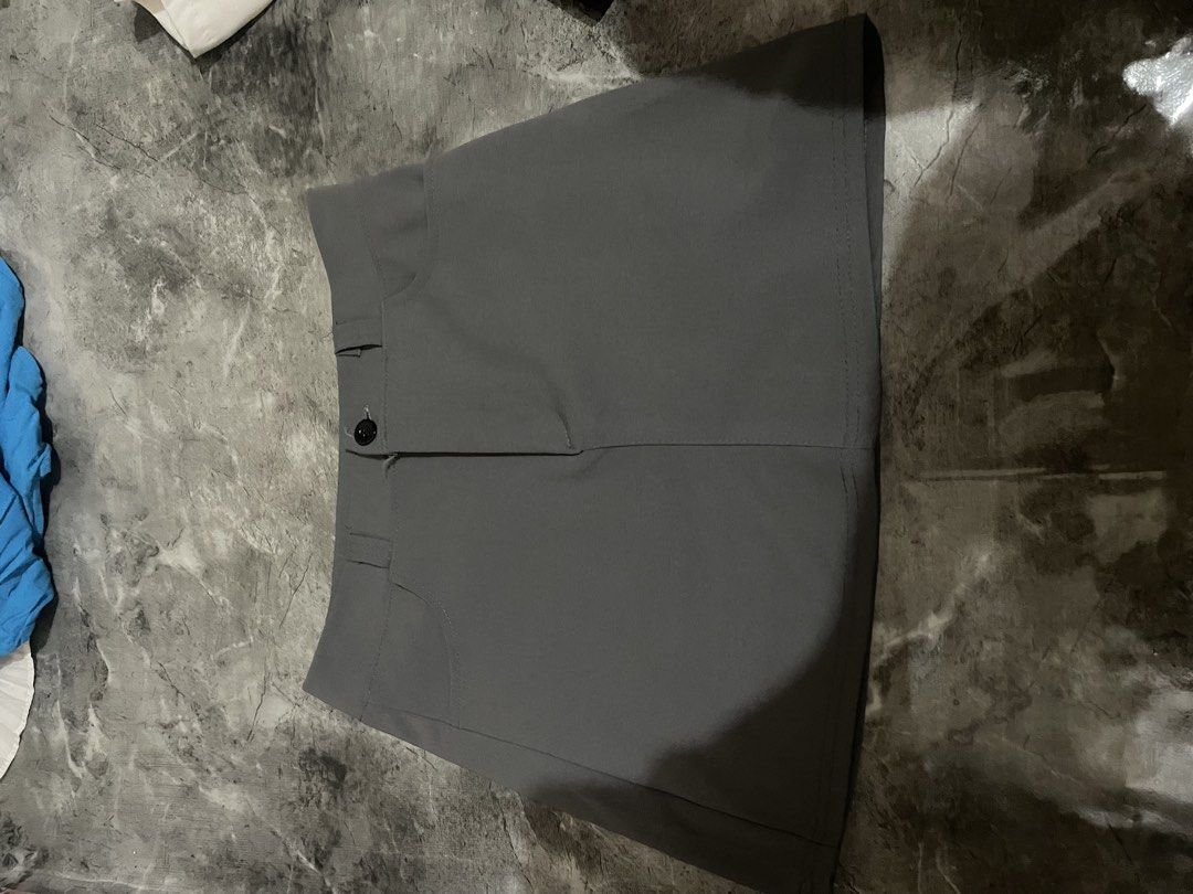 Grey Mini Skirt with Button Detail (Category: Skirts) located in Manila. Submitted by bev2001 (Listing ID 1465844892, Image 1). Description: - Color: Solid grey - Closure: Front button with zipper fly - Design: Structured waistband with subtle pocket stitching - Style: Mini length, easy to mix and match with various tops.