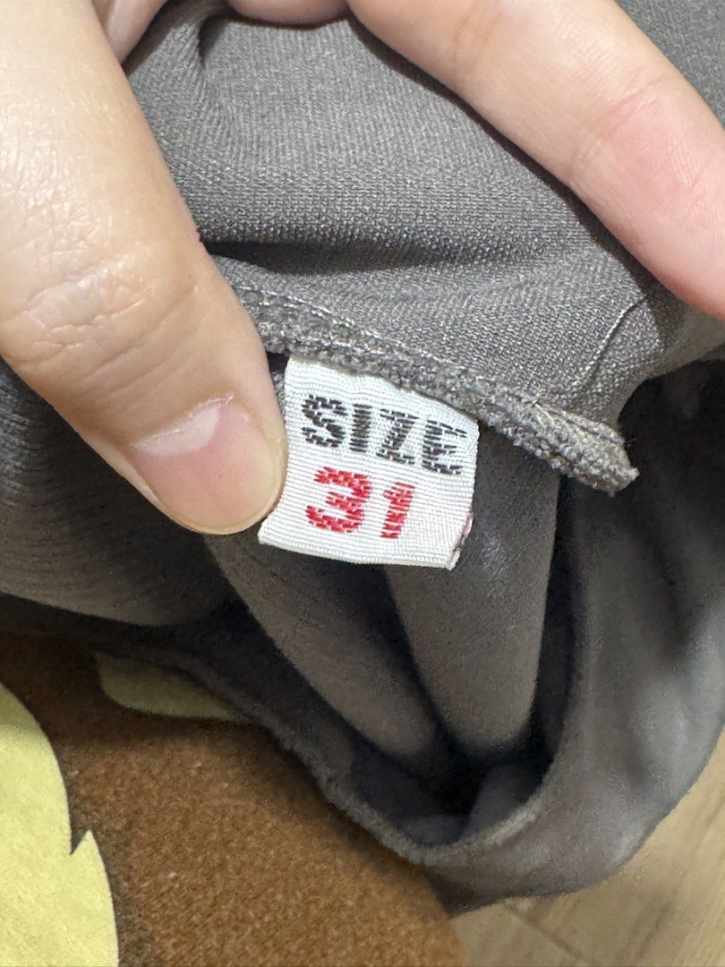 Grey mini skirt with side slit size 31 (Category: Skirts) located in San Juan City. Submitted by pewchipie (Listing ID 1465893773, Image 2). Description: - Color: Grey - Style: Mini skirt with a chic right-side hem slit - Fit: Pull-on style with a comfortable elastic waistband - Fabric: Soft and cozy texture - Size: Tagged size 31 - Condition: Great for casual everyday outfits.