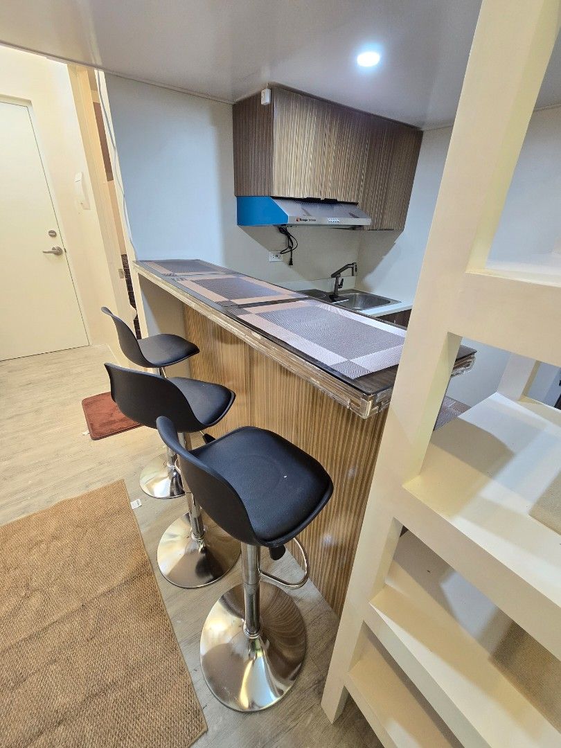 Grey pull out sofa bed with cushions (Category: Apartments & Condos) located in Pasig City. Submitted by condoforrent2026 (Listing ID 1465933269, Image 3). Description: Fully furnished/complete appliances Studio unit with loft type bed/room with balcony 23k/month (inclusions: wifi, assoc. Dues) 1+1 Location: Avenida Manila Very near to lrt doroteo jose/lrt recto Near to universities (Feu,Ue,Ceu, San Beda,etc), Review centers, etc. 👫 Ideal for 2 
