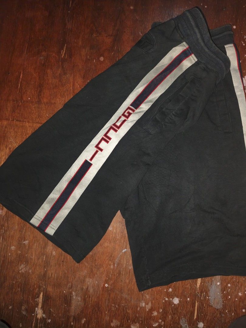 Gucci Black Sweatshorts with Side Stripes (Category: Shorts) located in Manila. Submitted by esteemed_shop (Listing ID 1465895388, Image 2). Description: -no tags - 100% Authentic Gucci cotton sweatshorts in classic black - Thick adjustable drawstring waist with branded metal aglets - Iconic red and blue contrast side tape with Gucci lettering on the left leg - Functional design with two front pockets and a single rear flap pocket - Heavyweight, 