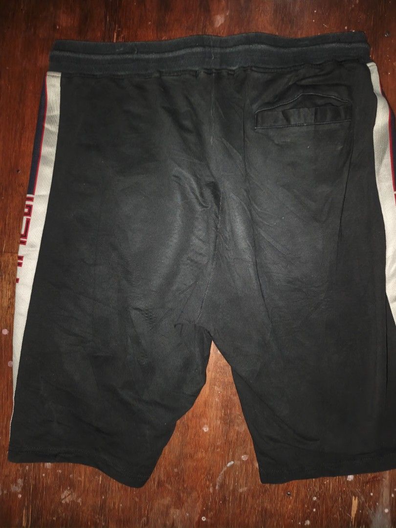 Gucci Black Sweatshorts with Side Stripes (Category: Shorts) located in Manila. Submitted by esteemed_shop (Listing ID 1465895388, Image 3). Description: -no tags - 100% Authentic Gucci cotton sweatshorts in classic black - Thick adjustable drawstring waist with branded metal aglets - Iconic red and blue contrast side tape with Gucci lettering on the left leg - Functional design with two front pockets and a single rear flap pocket - Heavyweight, 