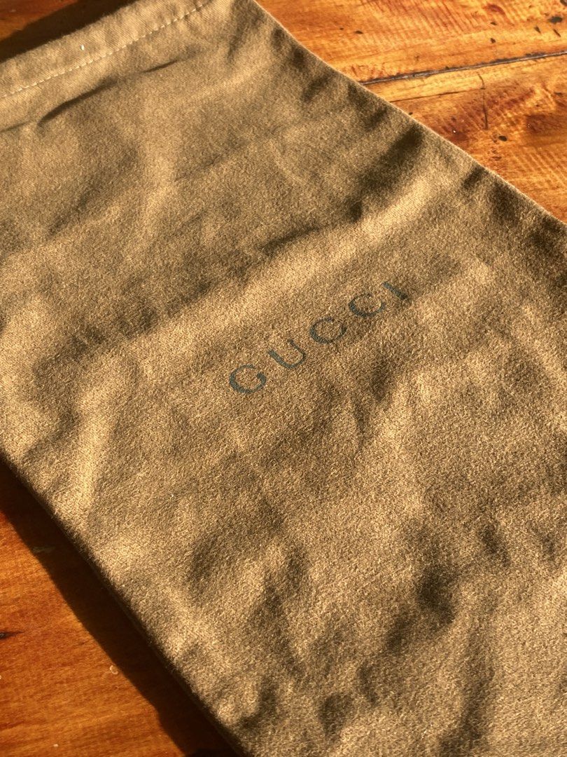 Gucci Brown Dust Bag (Category: Luxury Bags & Wallets) located in San Fernando. Submitted by jecscollectionsshoppee (Listing ID 1465841669, Image 2). Description: - Authentic Gucci dust bag - Color: Brown cotton fabric - Closure: Drawstring top - Details: Classic Gucci logo stamped on the front - Condition: Clean interior and exterior - Size: Standard medium, ideal for luxury bags or accessories.
