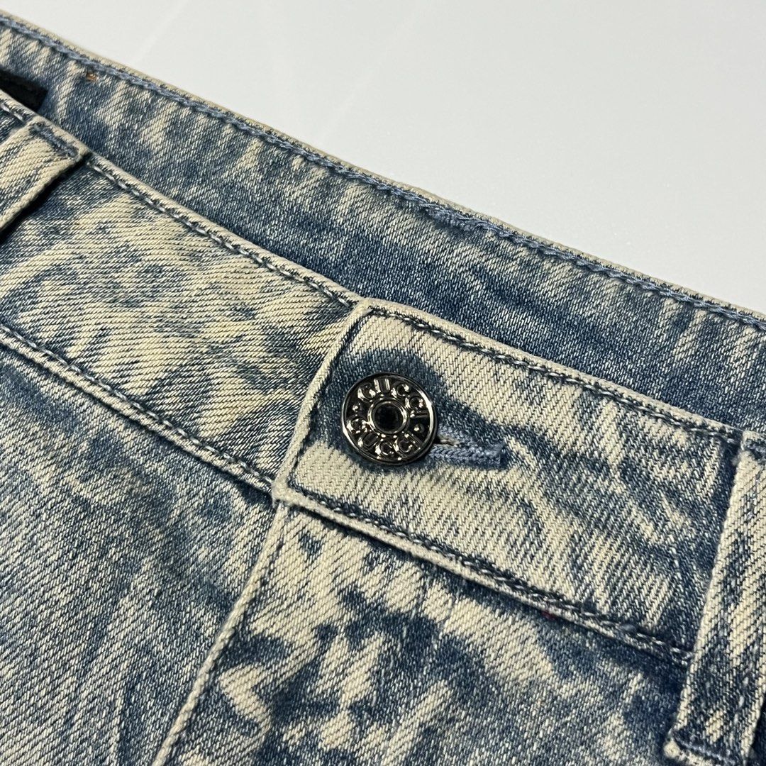 Gucci Embellished Denim Skirt (Category: Skirts) located in Caloocan City. Submitted by lostarchive_55 (Listing ID 1465916087, Image 3). Description: - Brand: Gucci - Style: Mid-length denim skirt with front seam detail and classic 5-pocket design - Wash: Blue acid wash - Size: 42 (Made in Italy) - Details: Covered in metallic flower studs with orange center beads and rhinestone crystals - Finish: Raw hem bottom with branded hardware on button an