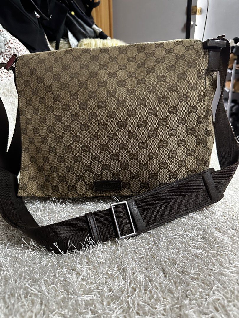 Gucci GG Monogram Messenger Bag Brown (Category: Luxury Bags & Wallets) located in Manila. Submitted by aisasalvad24335 (Listing ID 1465802681, Image 3). Description: - Authentic Gucci messenger bag in brown GG monogram canvas - Adjustable heavy-duty dark brown canvas strap - Secure flap closure with embossed leather Gucci patch - Practical everyday size for daily essentials, books, or a tablet - Sturdy hardware and clean, durable stitching throu