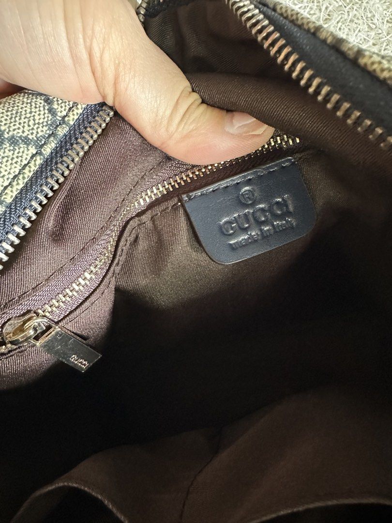 Gucci GG Supreme Canvas Messenger Bag (Category: Luxury Bags & Wallets) located in Manila. Submitted by aisasalvad24335 (Listing ID 1465802282, Image 2). Description: - Authentic Gucci messenger bag in classic GG Supreme canvas - Dark blue adjustable shoulder strap with premium gold-tone hardware - Convenient front zippered pocket with leather pull tab - Clean brown fabric interior lining with an additional zippered pocket - Features official deb