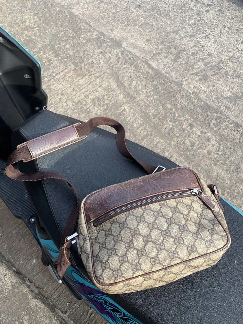 Gucci GG Supreme Sling Bag (Category: Sling Bags) located in Gingoog City. Submitted by pureshark-307a (Listing ID 1465841494, Image 1). Description: - Authentic Gucci messenger bag in signature GG Supreme canvas - Premium brown leather trim and durable zip closure - Adjustable brown web strap with a comfortable padded shoulder piece - Convenient zippered exterior front pocket for easy access - Compact yet spacious main compartment, ideal for dai
