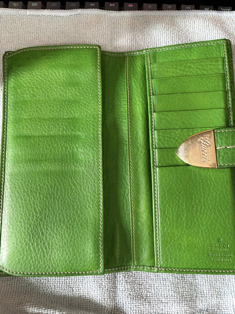 Gucci Green Leather Monogram Long Wallet (Category: Luxury Bags & Wallets) located in Manila. Submitted by pasabuyfromkl (Listing ID 1465813028, Image 2). Description: - used in good condition - NO INCLUSIONS - Authentic Gucci long wallet in a striking bright green embossed leather - Elegant gold-tone metal clasp closure stamped with the Gucci signature - Features multiple card slots and spacious bill compartments - Rare 'Gucci Made in Italy Hong