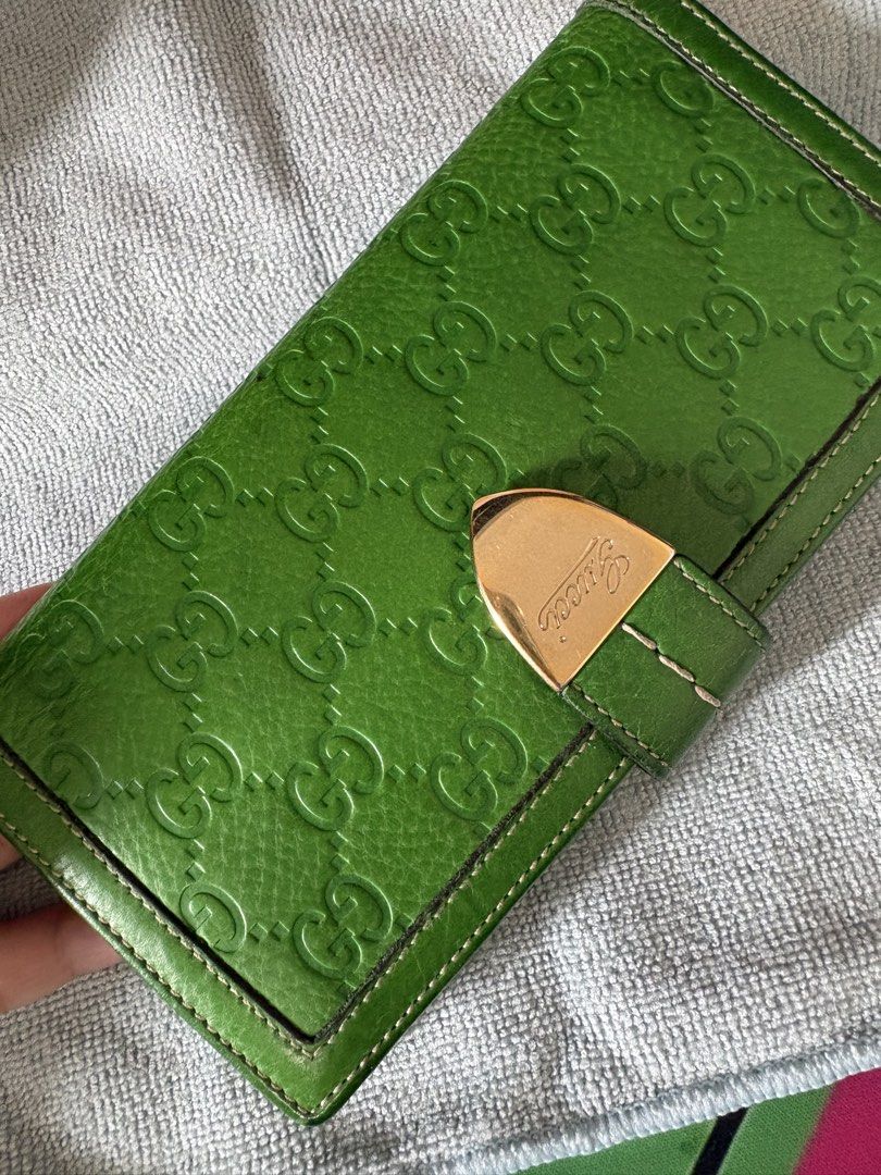 Gucci Green Leather Monogram Long Wallet (Category: Luxury Bags & Wallets) located in Manila. Submitted by pasabuyfromkl (Listing ID 1465813028, Image 1). Description: - used in good condition - NO INCLUSIONS - Authentic Gucci long wallet in a striking bright green embossed leather - Elegant gold-tone metal clasp closure stamped with the Gucci signature - Features multiple card slots and spacious bill compartments - Rare 'Gucci Made in Italy Hong