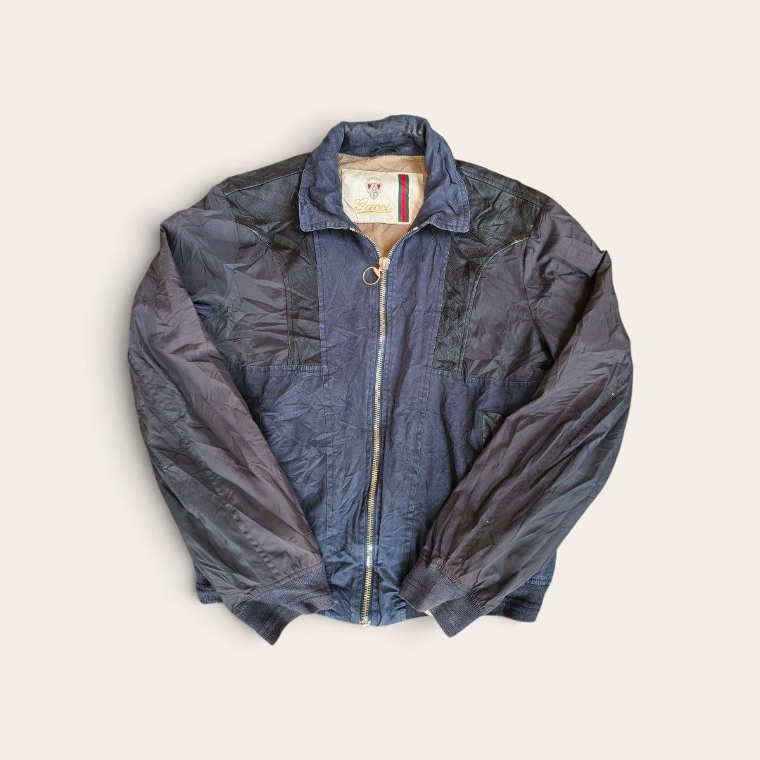 Gucci Vintage Nav& black light hybrid jacket (Category: Coats, Jackets and Outerwear) located in Quezon City. Submitted by StashThriftPH (Listing ID 1465843969, Image 1). Description: good condition 9/10 Location Novaliches Qc pm for issue.