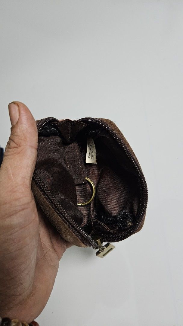 Guess Brown Suede Coin Purse Pouch (Category: Purses & Pouches) located in Alfonso. Submitted by jbcamet (Listing ID 1465923943, Image 3). Description: - Brand: Guess - Material: Real leather suede exterior with polyester lining - Color: Brown with brass hardware - Closure: Secure zipper with Guess logo pull - Features: Rectangular shape, front Guess logo plaque, and interior key ring - Condition: Great for organizing loose change and small essen