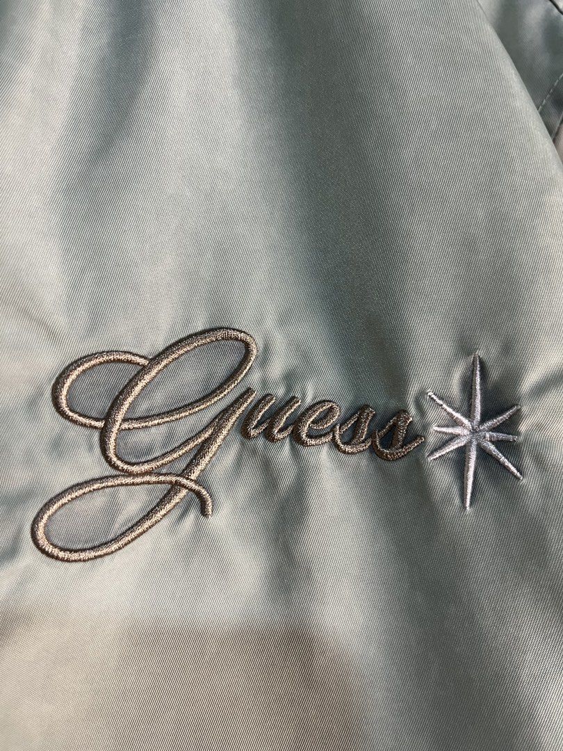 Guess jeans green bomber jacket (Category: Announcements) located in Palo. Submitted by marllennon (Listing ID 1465875924, Image 2). Description: Guess jeans green bomber Jacket Authentic no issue excellent condition color rate 10/10 W - 20.5 L - 23 Location: Palo leyte JNT EXPRESS 🚚.