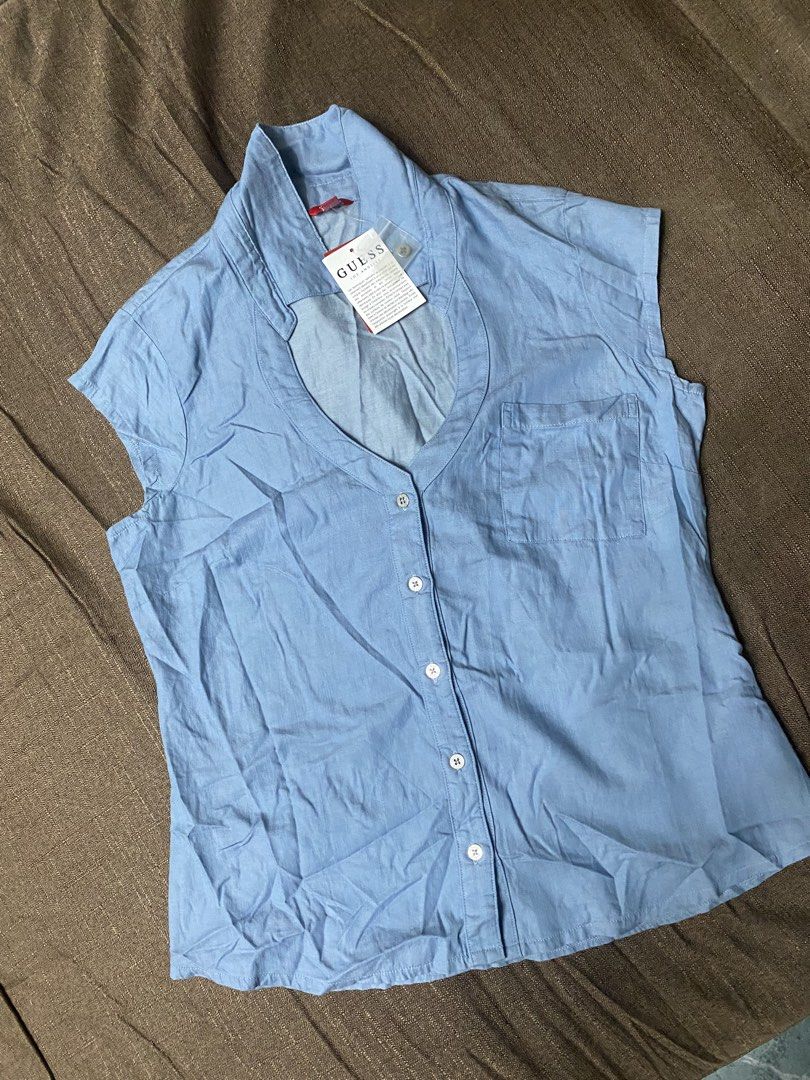 Guess Los Angeles Marlowe Chambray Top (Category: Sleeveless) located in Quezon City. Submitted by mt031199 (Listing ID 1465946748, Image 1). Description: - Brand: Guess Los Angeles - Color: Light blue (denim-look) - Style: Sleeveless button-up with classic collar and front chest pocket - Condition: Brand new with original tag attached - Material: Lightweight and comfortable - Perfect casual everyday piece!.