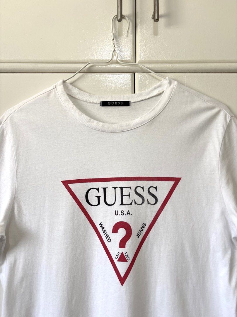 GUESS WHITE LOGO PRINTED T-SHIRT (Category: Tshirts & Polo Shirts ) located in Bulacan. Submitted by kennyfindss (Listing ID 1465871820, Image 2). Description: Size on Tag: Large | Unisex W: 18.5–19” L: 28” Sleeves: 8” Color Rate: 9.8/10 Condition: Lightly Used Fabric/Material: Cotton DM TO PURCHASE .