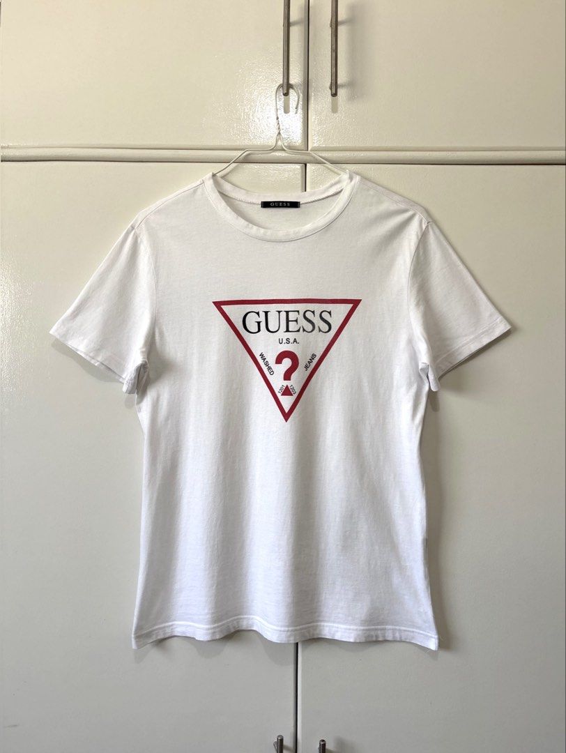 GUESS WHITE LOGO PRINTED T-SHIRT (Category: Tshirts & Polo Shirts ) located in Bulacan. Submitted by kennyfindss (Listing ID 1465871820, Image 1). Description: Size on Tag: Large | Unisex W: 18.5–19” L: 28” Sleeves: 8” Color Rate: 9.8/10 Condition: Lightly Used Fabric/Material: Cotton DM TO PURCHASE .