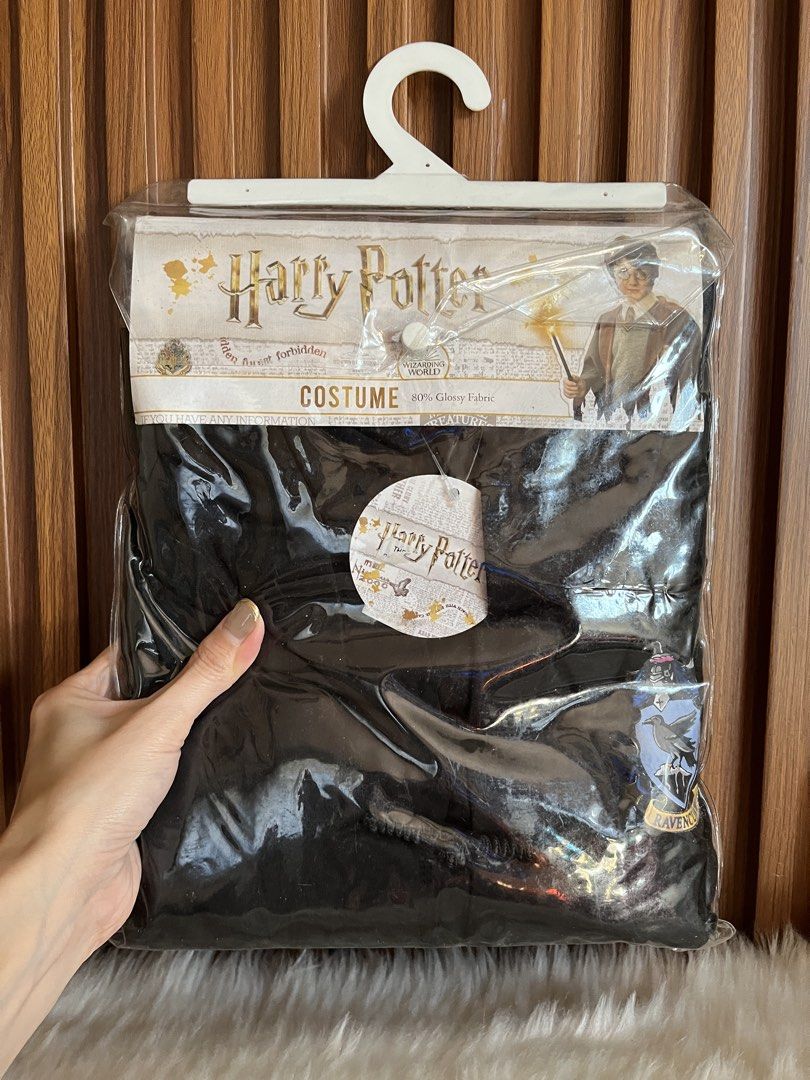 Harry Potter Ravenclaw Costume Size L (Category: Babies & Kids Fashion) located in Navotas City. Submitted by mommybabyc (Listing ID 1465879770, Image 1). Description: - Official Wizarding World Harry Potter Ravenclaw costume - Size: L - Condition: Brand new, unopened in original packaging with hanger and cardboard backing - Includes: Black robe with embroidered Ravenclaw house crest patch - Ideal for: Halloween, costume parties, and dress-up eve