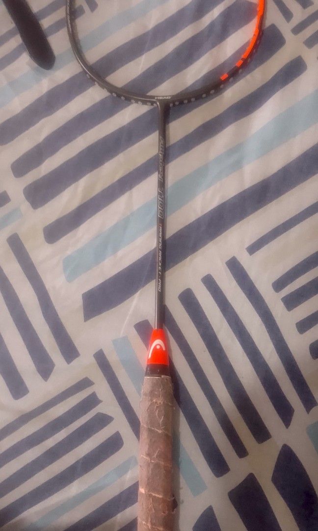 Head Airplay T100 Training Racket Pro (Category: Racket and Ball Sports) located in Manila. Submitted by andypecho345843 (Listing ID 1465186639, Image 3). Description: - Model: Head Airplay T100 Training Racket Pro - Colorway: Black and Orange - Condition: Used and needs new Strings and either Towel or Rubber Grip Tape depending on the users preference 1 - Frame Status: Intact and sturdy - Best For: Training sessions, practice, and casual games -