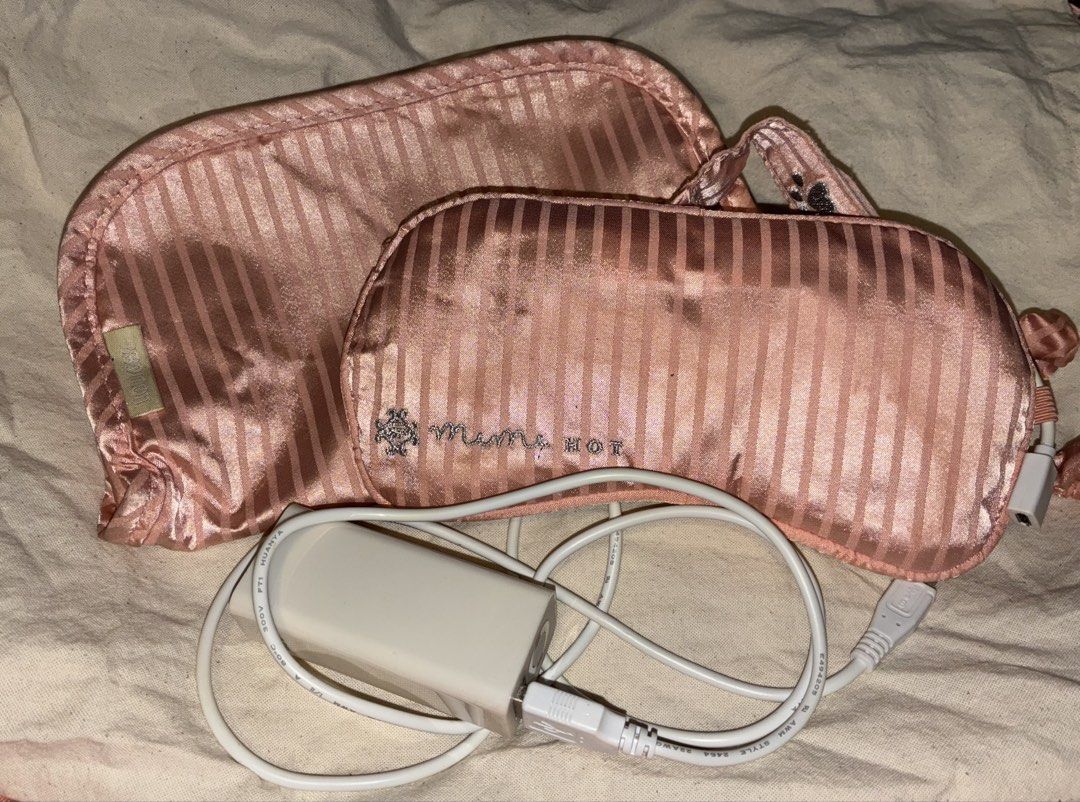 Heated Silk Eye Mask with Pouch and USB Cable (Category: Purses & Pouches) located in Manila. Submitted by jhie24 (Listing ID 1465845240, Image 1). Description: - Pink striped heated eye mask with matching storage pouch - Includes USB charging cable and power adapter - Adjustable Velcro strap with a cute rhinestone paw accent - Fully working condition - Flaw: Inner white lining has noticeable yellowish staining from previous use and needs a wash 