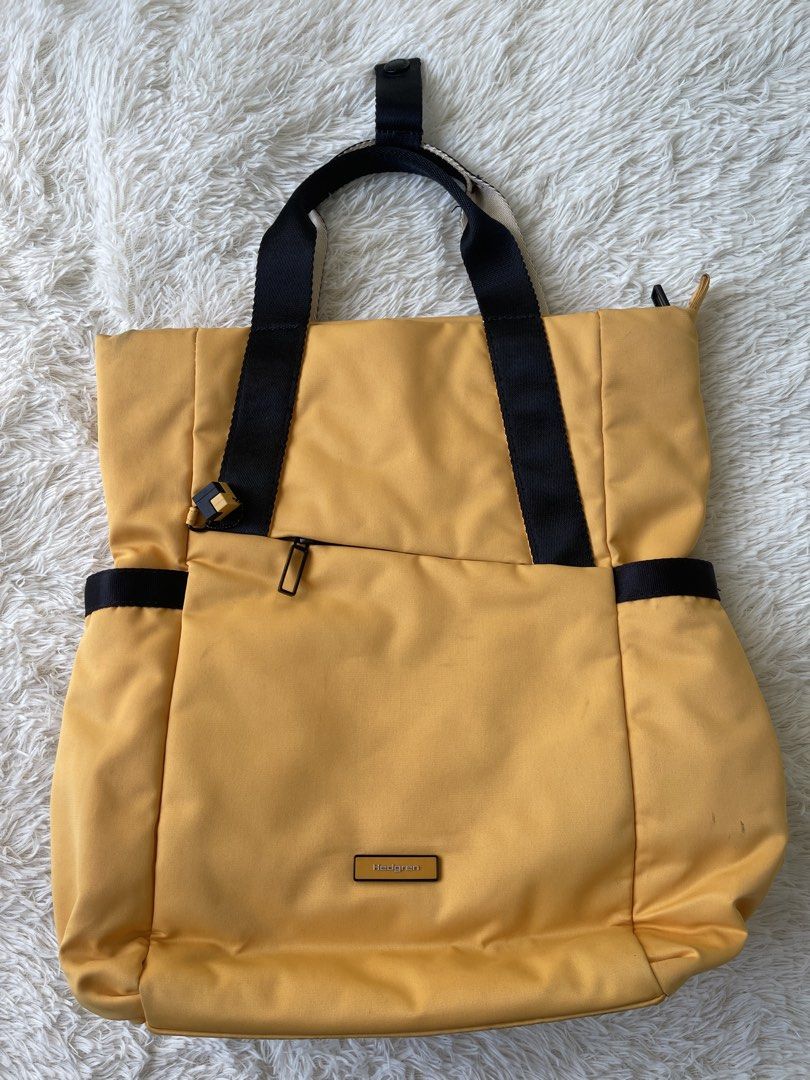 Hedgren Nova Tiger Eye 2-Way Backpack (Category: Backpacks) located in Malolos. Submitted by ishnnt (Listing ID 1465907350, Image 1). Description: - Brand: Hedgren Nova convertible bag - Color: Tiger Eye yellow - Versatility: Easily converts from a tote to a backpack - Laptop Compatibility: Fits up to a 14-inch laptop (verified by original tags) - Interior Features: Includes a zipped pocket and handy dividers - Condition: Brand new with original 