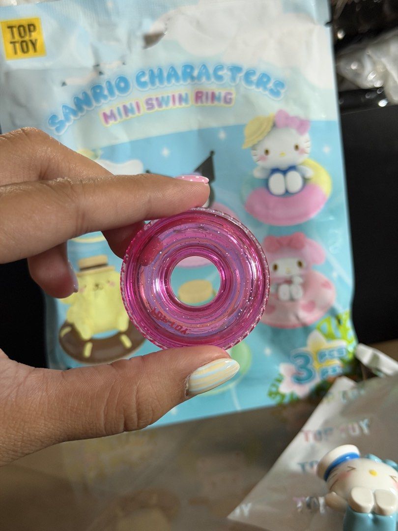 Hello Kitty Sanrio Characters Mini Swim Ring Top Toy (Category: Designer & Blind Box Toys) located in Manila. Submitted by jnndeclutter (Listing ID 1465829770, Image 3). Description: Crystal Hello Kitty - Series: Top Toy Sanrio Characters Mini Swim Ring Blind Box Figure - Character: Kitty (wearing a cute sailor hat and blue outfit) - Inclusion: Matching sparkly pink swim ring - Condition: Opened only to check the design (like new) - Packaging: Or
