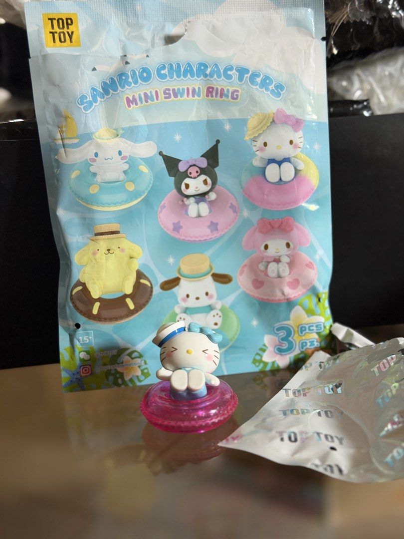Hello Kitty Sanrio Characters Mini Swim Ring Top Toy (Category: Designer & Blind Box Toys) located in Manila. Submitted by jnndeclutter (Listing ID 1465829770, Image 1). Description: Crystal Hello Kitty - Series: Top Toy Sanrio Characters Mini Swim Ring Blind Box Figure - Character: Kitty (wearing a cute sailor hat and blue outfit) - Inclusion: Matching sparkly pink swim ring - Condition: Opened only to check the design (like new) - Packaging: Or