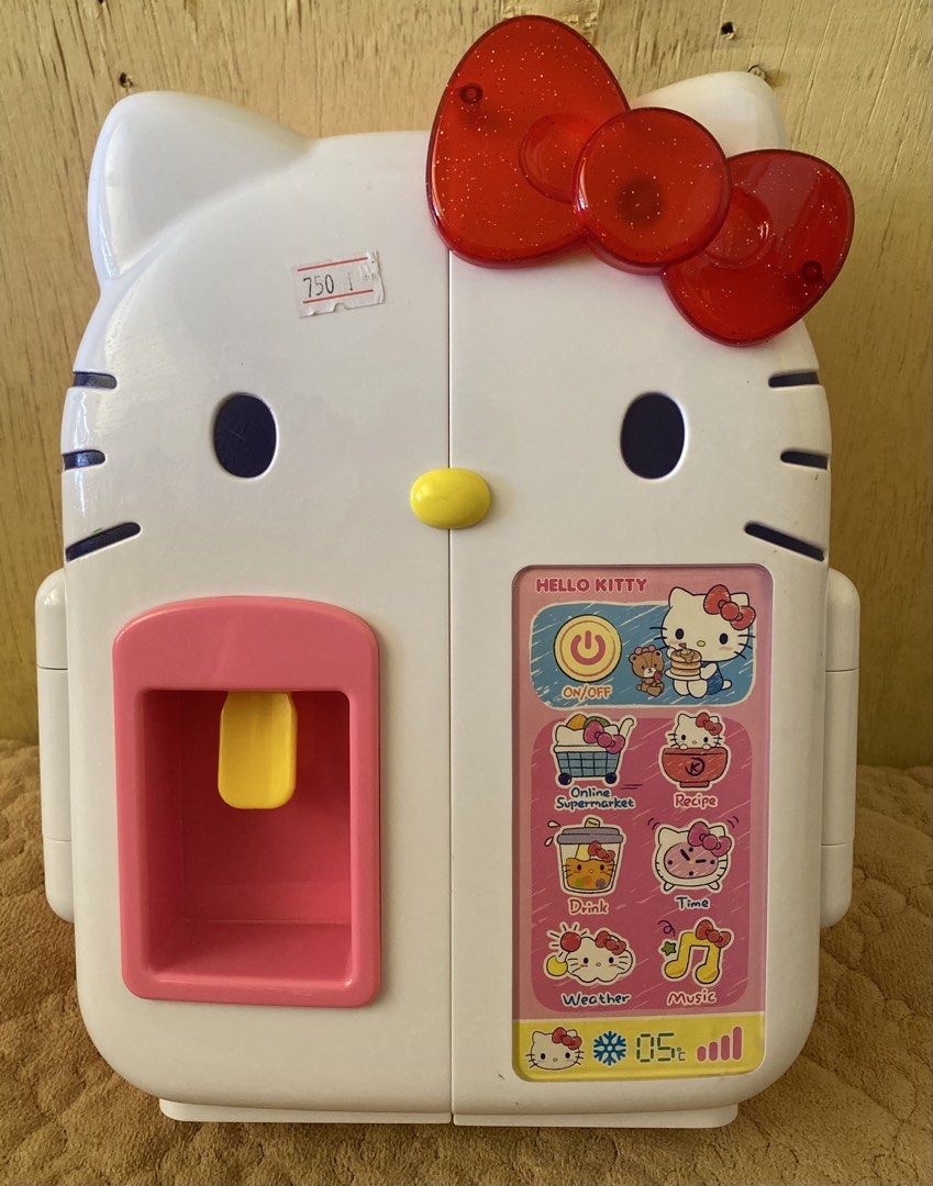 Hello Kitty Toy Refrigerator Playset (Category: Kids Toys) located in Baguio. Submitted by thrift_bonita (Listing ID 1465906458, Image 1). Description: - Adorable Kitty pink and white interactive toy fridge - Features a working water dispenser lever, mini shelves, and egg holder - Includes fun play food: milk carton, soda cans, and ice cream tubs - Battery-operated play set (batteries at the bottom) working with sounds - Perfect for kids' pretend