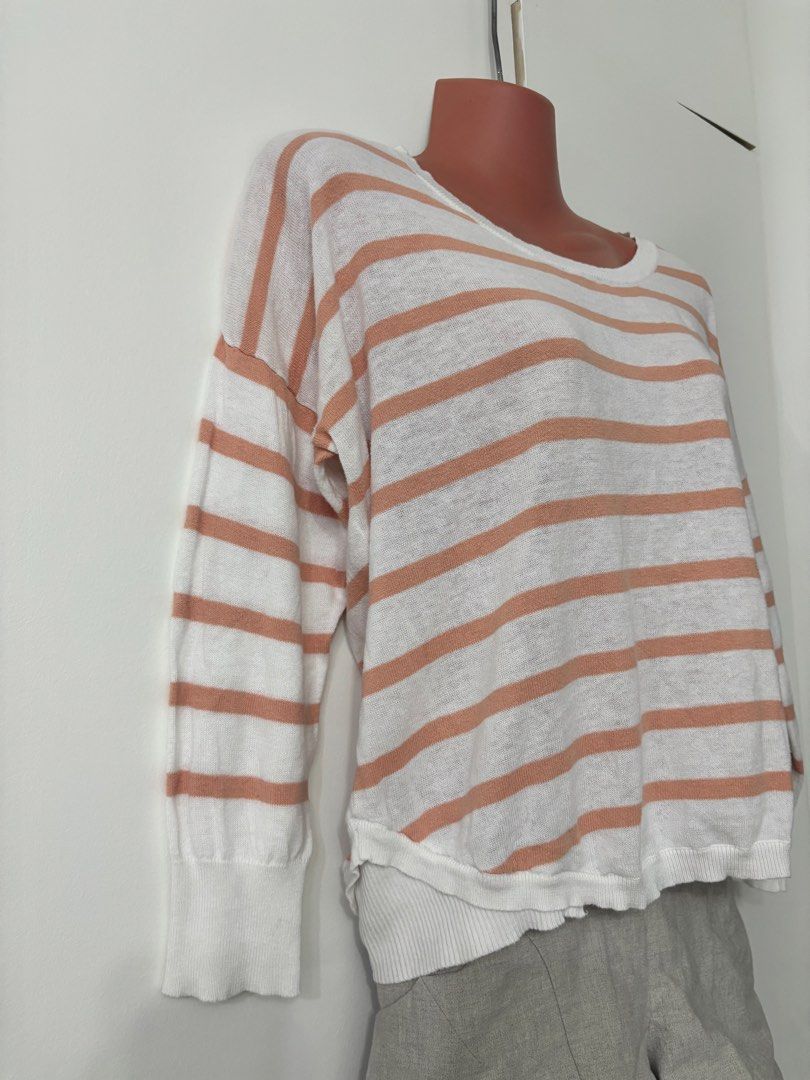 Herbench Striped Knit Shirt (Category: Longsleeves) located in Taguig. Submitted by wena11 (Listing ID 1465867230, Image 2). Description: - Brand: Herbench - Color: White with peach stripes - Size: Large - Design: Long sleeves, round neckline, button placket detail down the back - Details: Ribbed cuffs and hemline, lightweight knit fabric - Fit: Relaxed fit ***Get 1 item for FREE. Choose 1 from my listings priced Php 0/FREE..