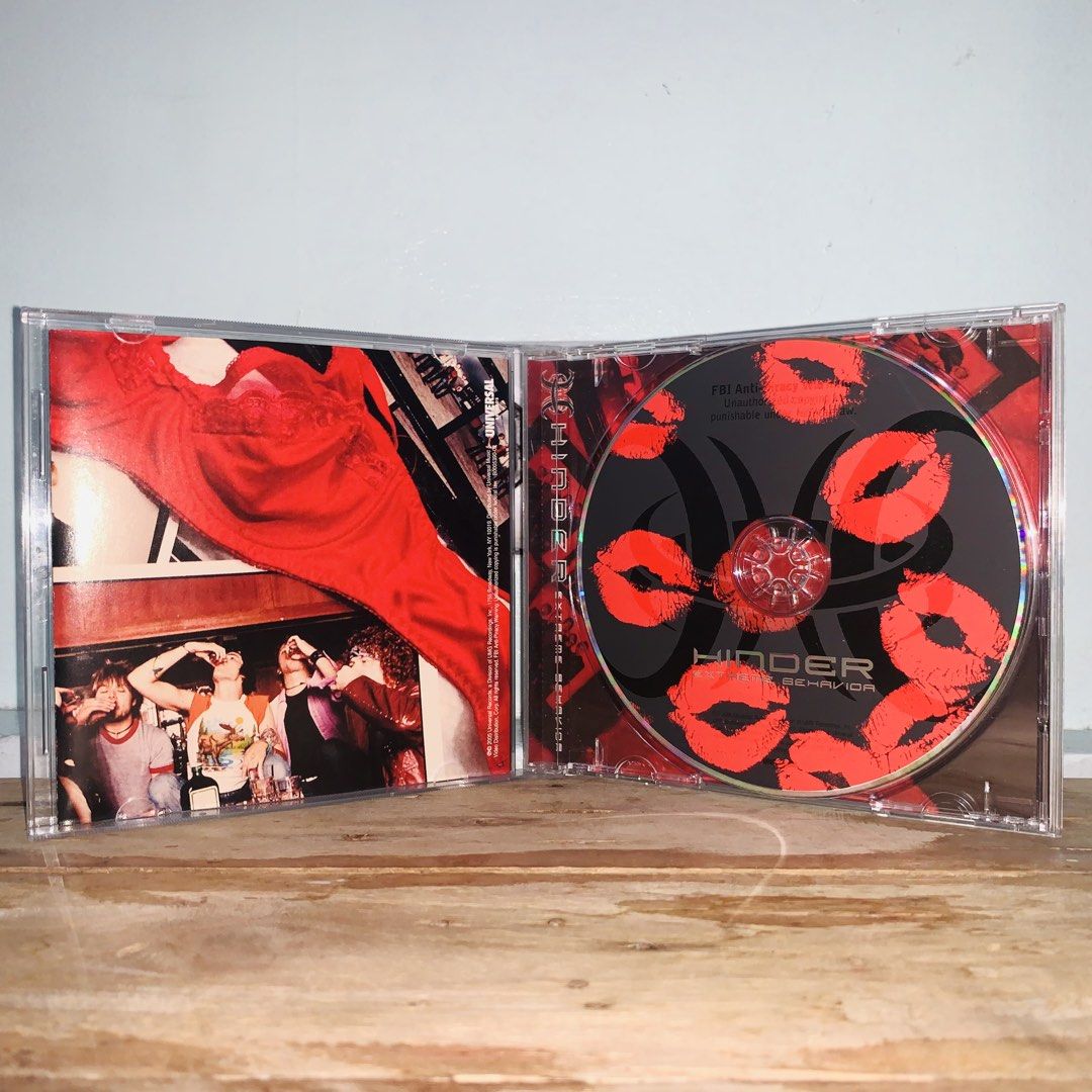Hinder Extreme Behavior Audio CD Album (Category: CDs & DVDs) located in Caloocan City. Submitted by offthegridfinds (Listing ID 1465945878, Image 2). Description: - Album: Hinder - Extreme Behavior (Debut Studio Album) - Format: Physical Compact Disc (CD) in standard jewel case - Inclusions: Original booklet with lyrics and band photos - Disc Design: Custom red kiss mark graphics on a black background - Condition: Play-tested and working fine; m