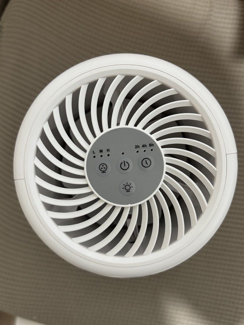 Hivo Mini Smart Air Purifier with Light (Category: Air Purifiers & Dehumidifiers) located in Manila. Submitted by kelbinooo (Listing ID 1465927568, Image 3). Description: Brand: Hivo Mini Smart Air Purifier - Color: Clean White with built-in ambient light - Design: Compact cylindrical with efficient lower-section air intake - Controls: Easy top panel for fan speed (Low, Med, High), Power, and Timer (2h, 4h, 8h) - Inclusions: Original retail box a