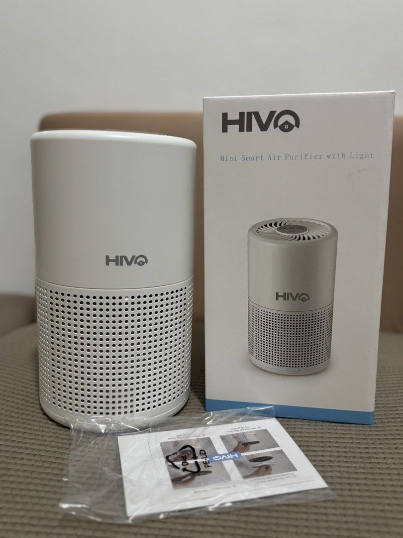 Hivo Mini Smart Air Purifier with Light (Category: Air Purifiers & Dehumidifiers) located in Manila. Submitted by kelbinooo (Listing ID 1465927568, Image 2). Description: Brand: Hivo Mini Smart Air Purifier - Color: Clean White with built-in ambient light - Design: Compact cylindrical with efficient lower-section air intake - Controls: Easy top panel for fan speed (Low, Med, High), Power, and Timer (2h, 4h, 8h) - Inclusions: Original retail box a