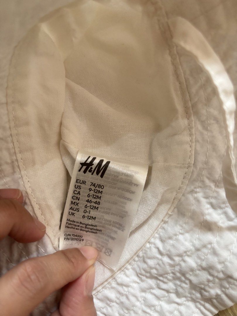 H&M baby white hat only , straw visor And strawberry bag set bundle (Category: Babies & Kids Fashion) located in Bulacan. Submitted by ricammendz (Listing ID 1465790601, Image 2). Description: Can fit til 24m - Adorable 3-piece summer accessory set for little ones (9-12M) - H&M white cotton sun hat (Size 74/80) - Straw sun visor featuring cute embroidered sleeping eyes and bunny ears - Matching straw sling bag decorated with three red strawberrie