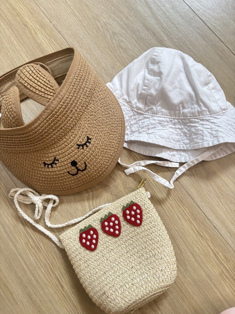 H&M baby white hat only , straw visor And strawberry bag set bundle (Category: Babies & Kids Fashion) located in Bulacan. Submitted by ricammendz (Listing ID 1465790601, Image 3). Description: Can fit til 24m - Adorable 3-piece summer accessory set for little ones (9-12M) - H&M white cotton sun hat (Size 74/80) - Straw sun visor featuring cute embroidered sleeping eyes and bunny ears - Matching straw sling bag decorated with three red strawberrie