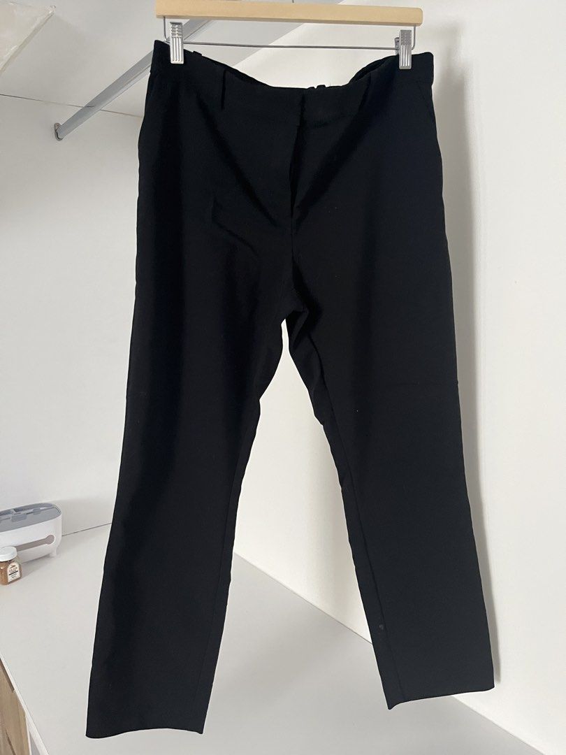 H&M Black Trousers (Category: Trousers) located in Quezon City. Submitted by cooperminie (Listing ID 1465816088, Image 1). Description: - Brand: H&M - Color: Black - Style: Regular fit trousers with button closure and belt loops (stretchy) - Pockets: Back welt pockets included - Size: EUR 46 / US 14 / UK 18 - Material: 50% polyester, 47% cotton blend (Made in Myanmar) - Condition: Clean, excellent, and ready to wear for work or casual outings.